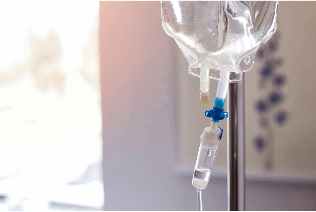 Close-up of an IV drip bag and tubing, representing the safe and controlled **IV Sedation** used for **deep relaxation** during dental procedures at Manassra Dental in San Jose.