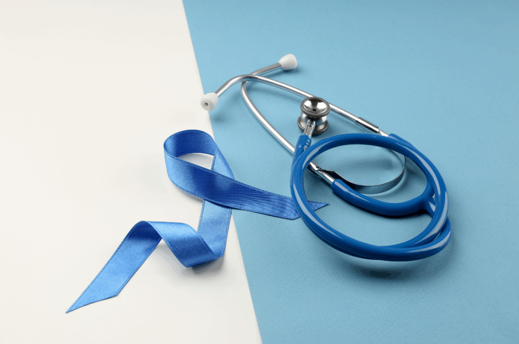 tethoscope and blue awareness ribbon, symbolizing medical vigilance and **oral cancer screening** for early detection at Manassra Dental in San Jose.