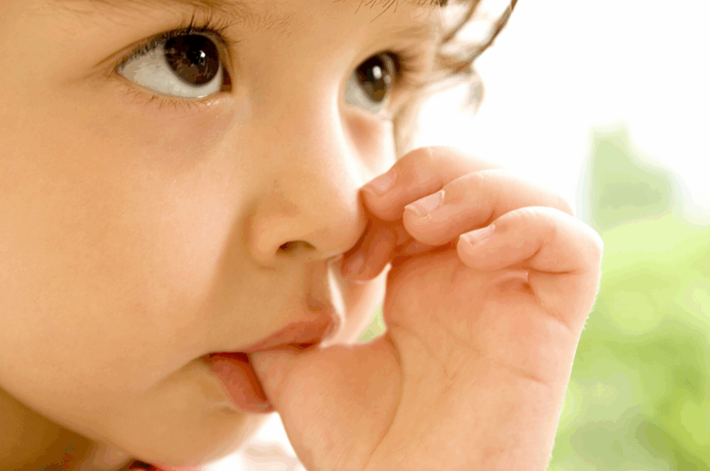 Young child gently sucking their thumb, illustrating the need for specialized **habit counseling** for thumb sucking and pacifier use at Manassra Dental in San Jose.