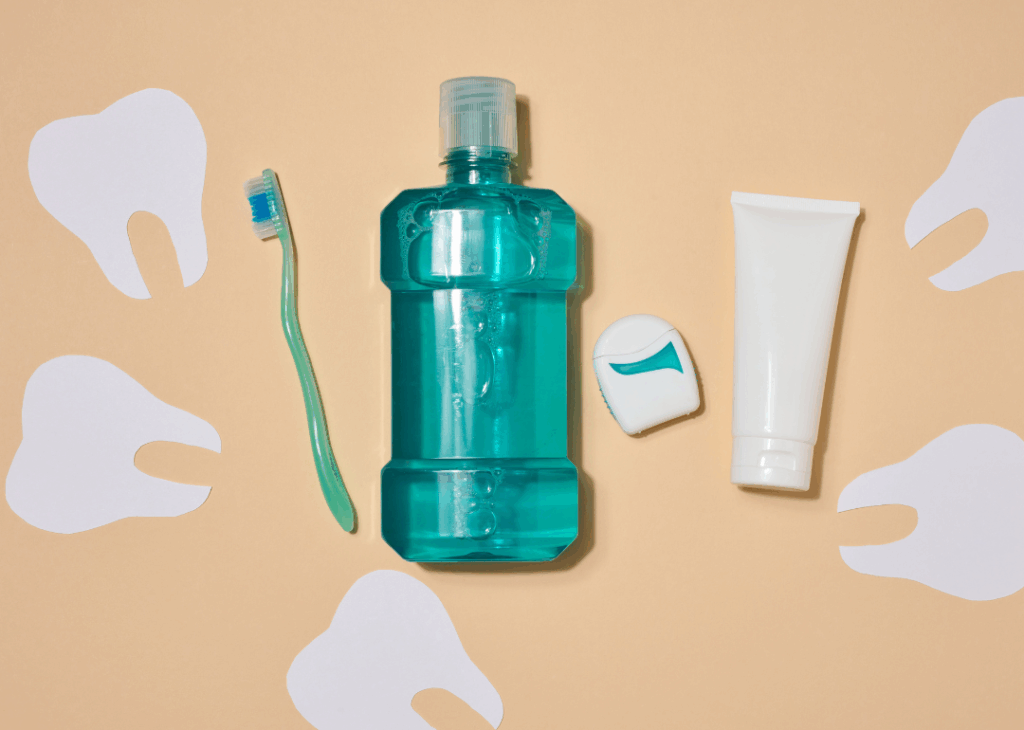 Mouthwash, toothbrush, toothpaste, and dental floss picks, illustrating the necessary tools for excellent oral hygiene and **protecting your smile for the future** at Manassra Dental in San Jose.