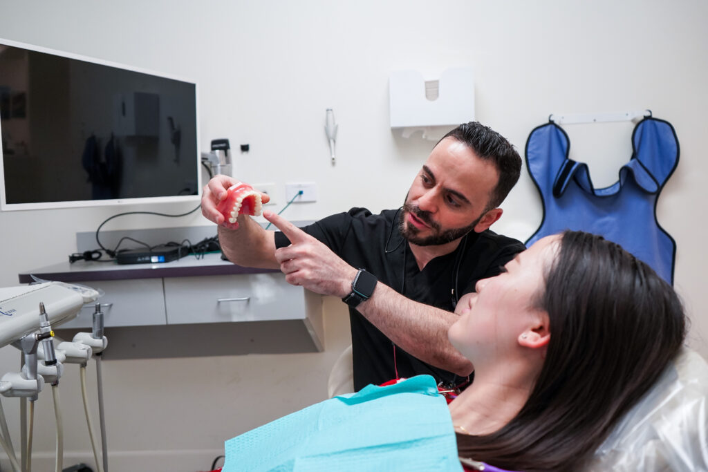 Patient receiving friendly and professional dental care at Manassra Dental.