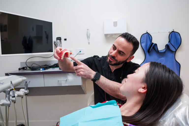 Patient receiving friendly and professional dental care at Manassra Dental.