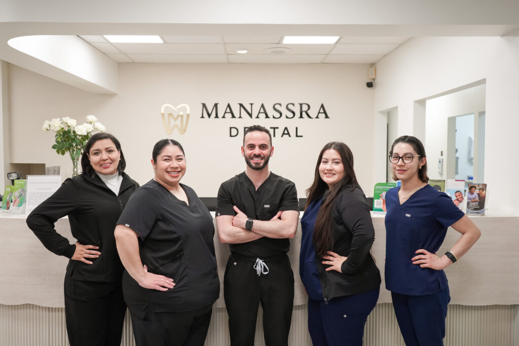 Dr. Ahmed with the full dental team at Manassra Dental, providing professional and friendly dental care.