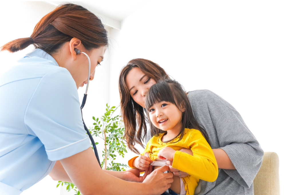 A young girl sitting in a dental chair with her mouth open during a routine examination at Manassra Dental.